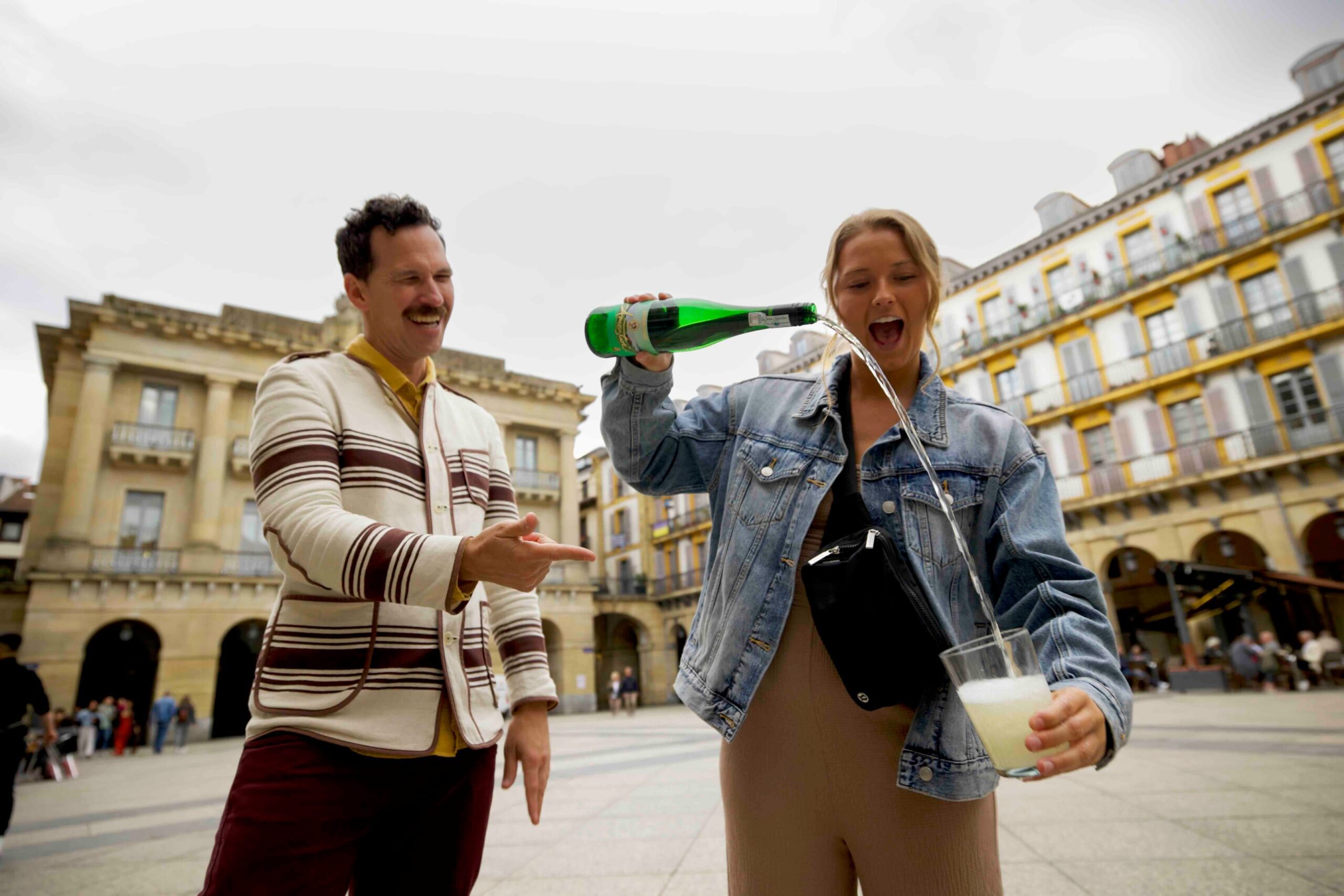 Pouring our local Txakoli wine the local way on our pintxos tour